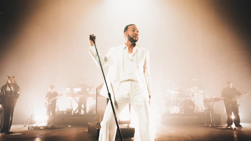 John Legend performing on stage